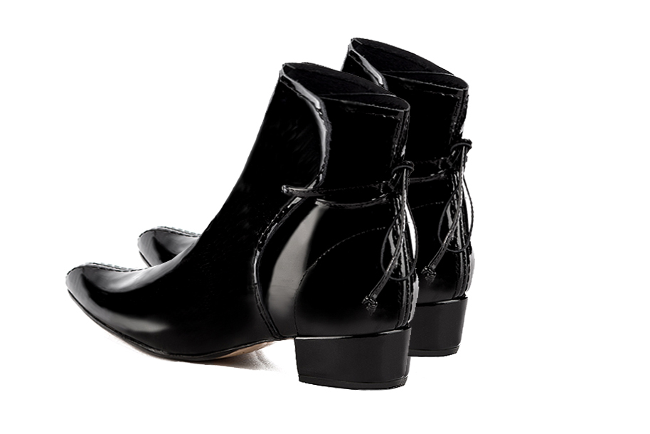 Gloss black women's ankle boots with laces at the back. Tapered toe. Low block heels. Rear view - Florence KOOIJMAN